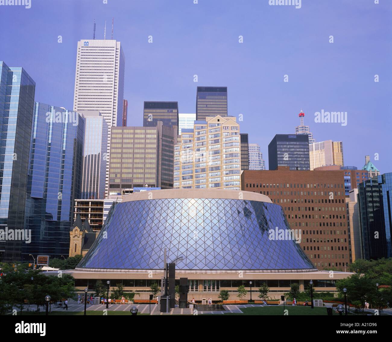 The Roy Thompson Hall theatre building with the skyline of the business centre of the city of Toronto behind Ontario Canada R Stock Photo