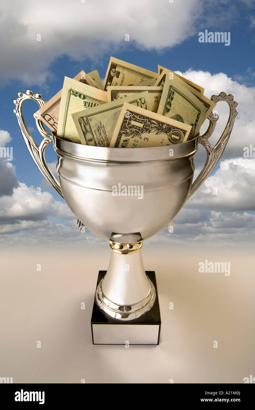 U.S. Currency in Silver Cup Stock Photo Alamy
