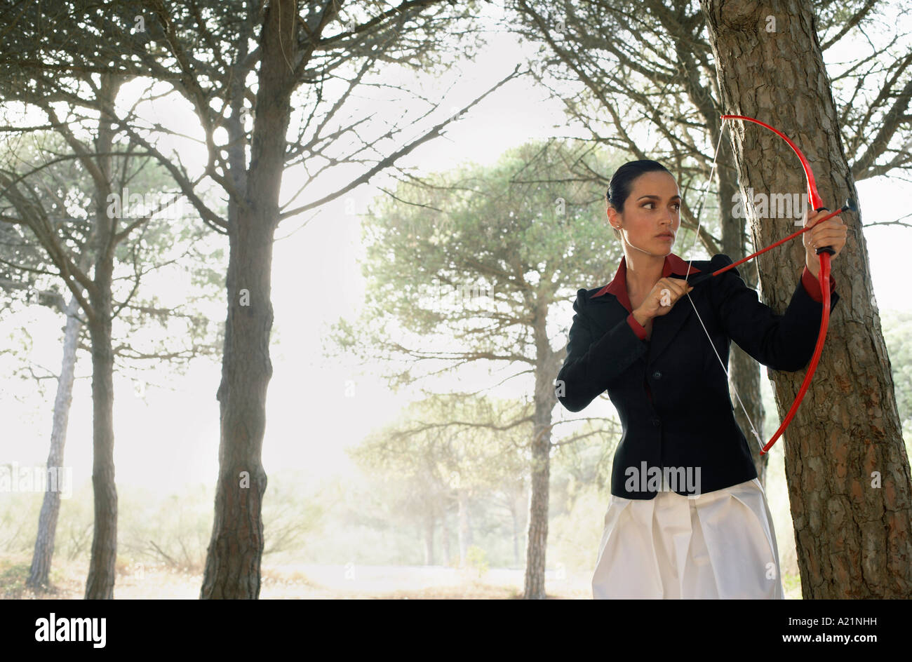 Woman using bow and arrow hi-res stock photography and images - Alamy