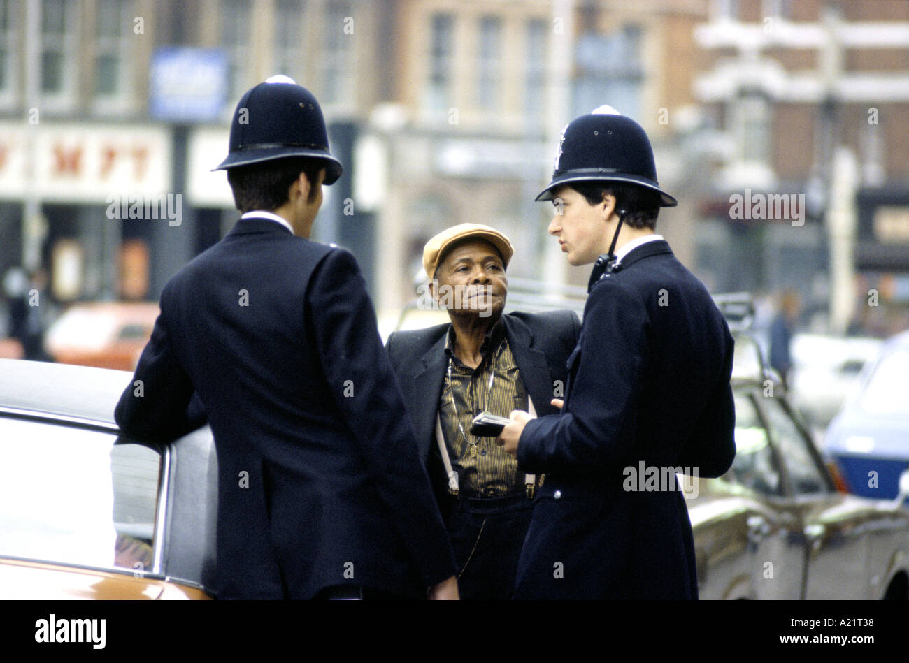 Police questioning a man in Brixton, London, UK Stock Photo