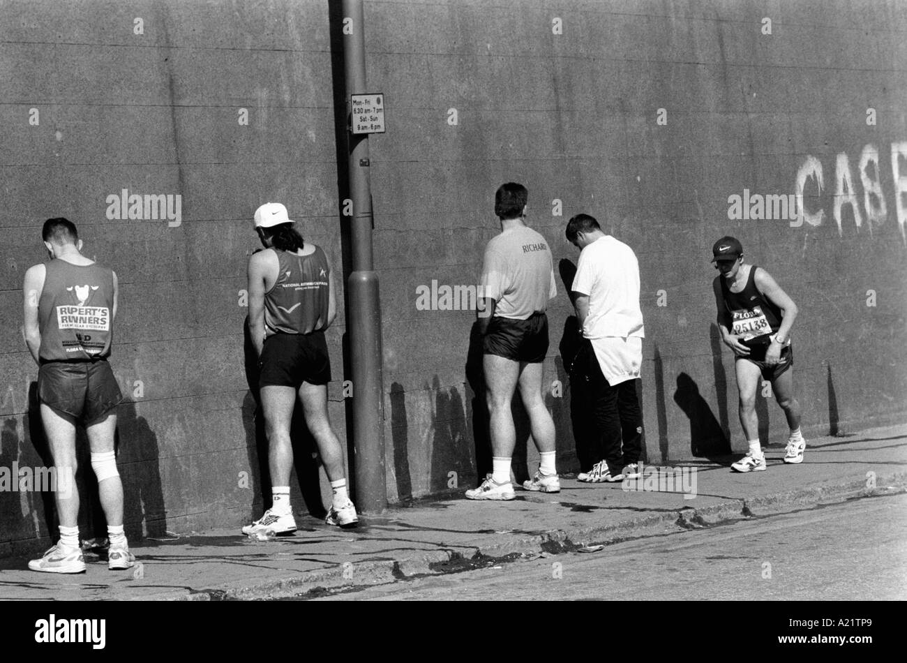 runners stop for a toilet break during the London marathon Stock Photo