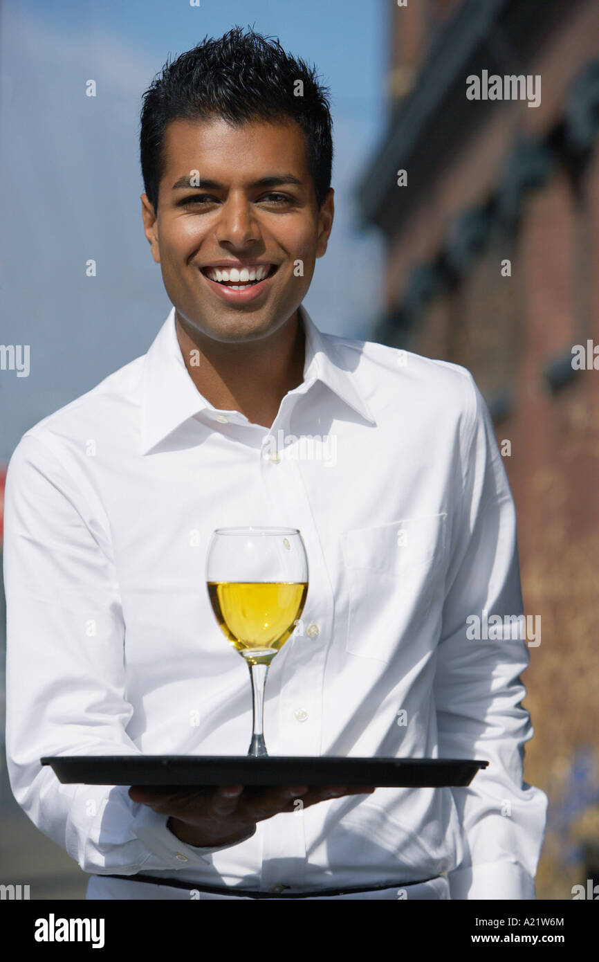 Waiter Carrying Glass of Wine Outdoors Stock Photo Alamy
