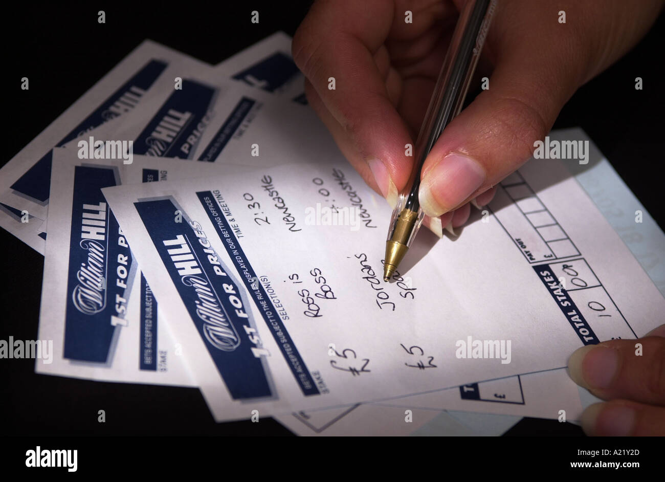 A woman writes on a William Hill betting slip Stock Photo: 3389228 ...