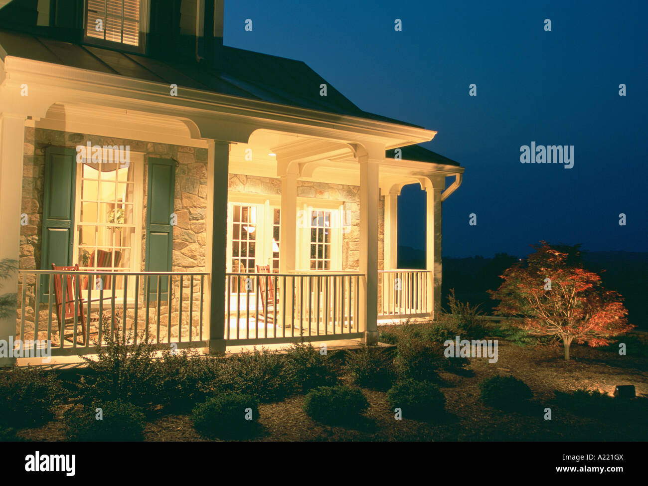 Wrap around porch at night warm lighting Stock Photo Alamy