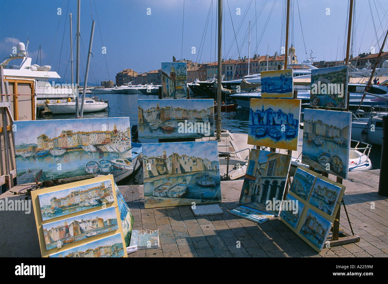 St Tropez harbour with display of art Provence France Stock Photo
