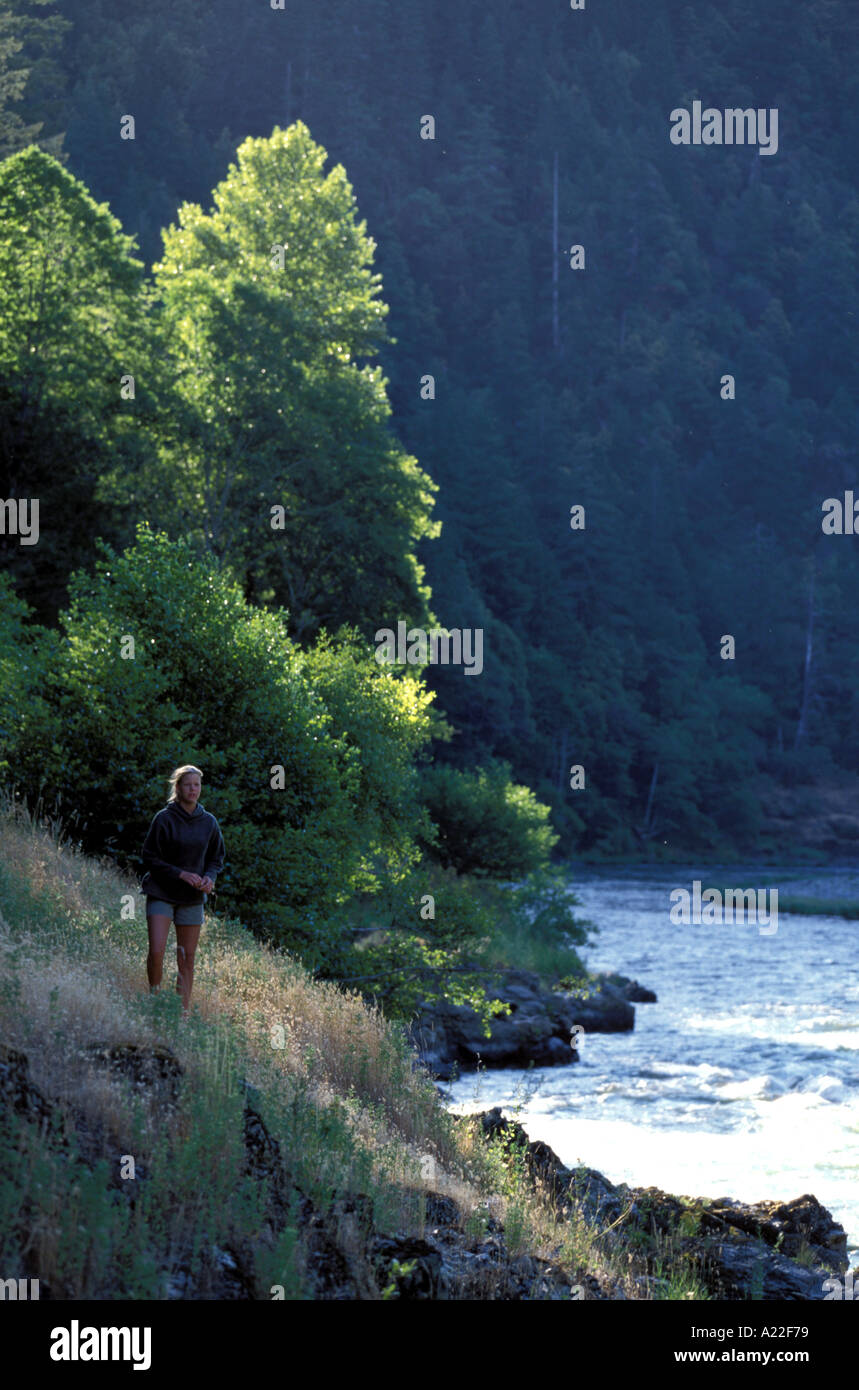Woman standing by river hi-res stock photography and images - Alamy