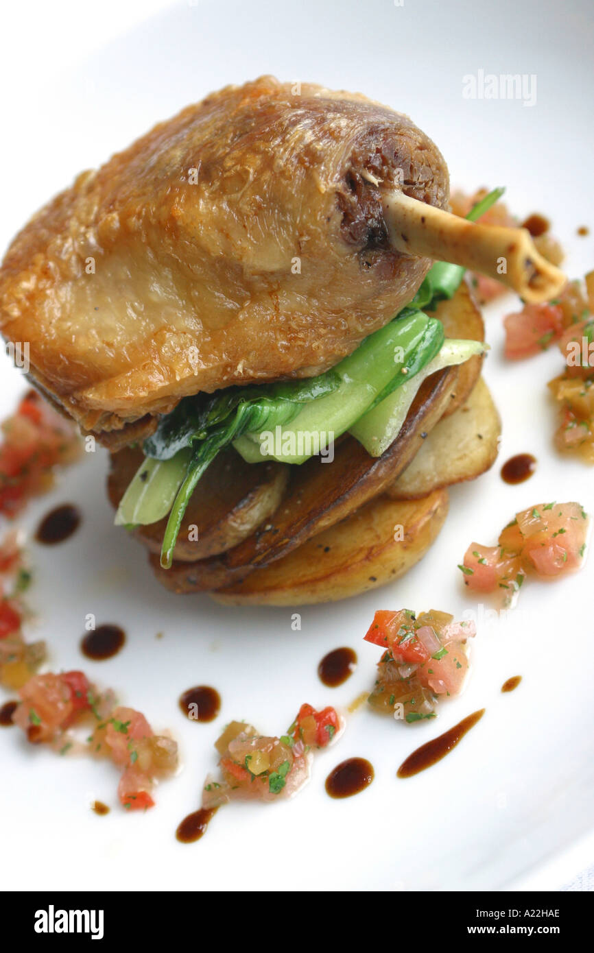 Food is Confit duck leg saute potatoes sauce vierge Stock Photo - Alamy