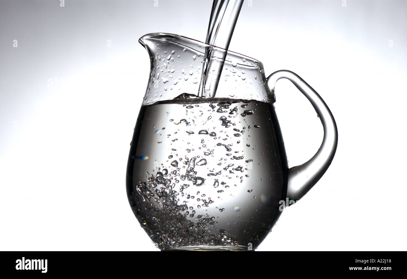 clear water being poured into glass pitcher Stock Photo Alamy