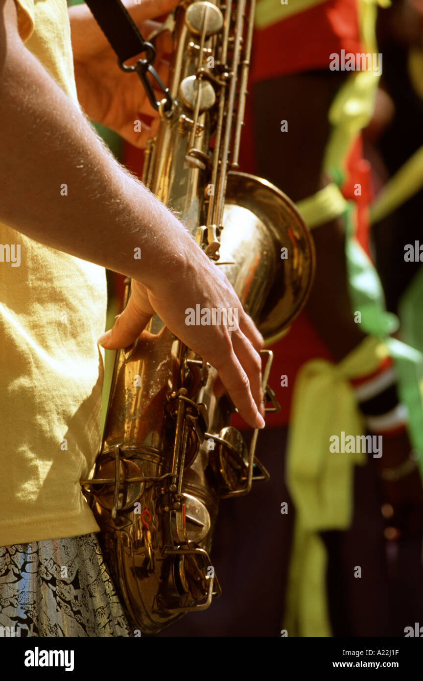 Saxophone player at street carnival St Pauls Bristol England UK Stock