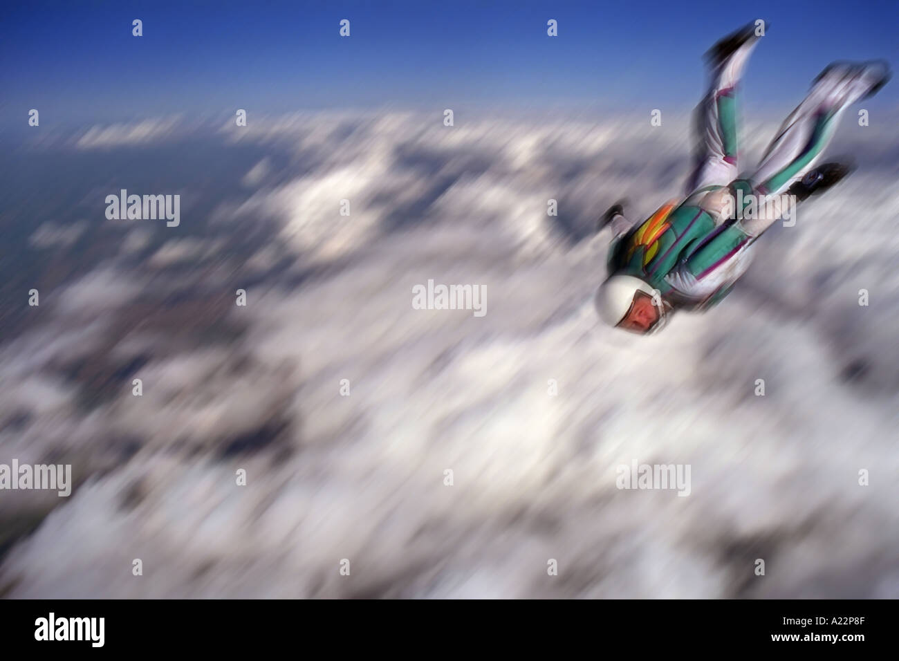 A skydiver speeds across the sky Stock Photo