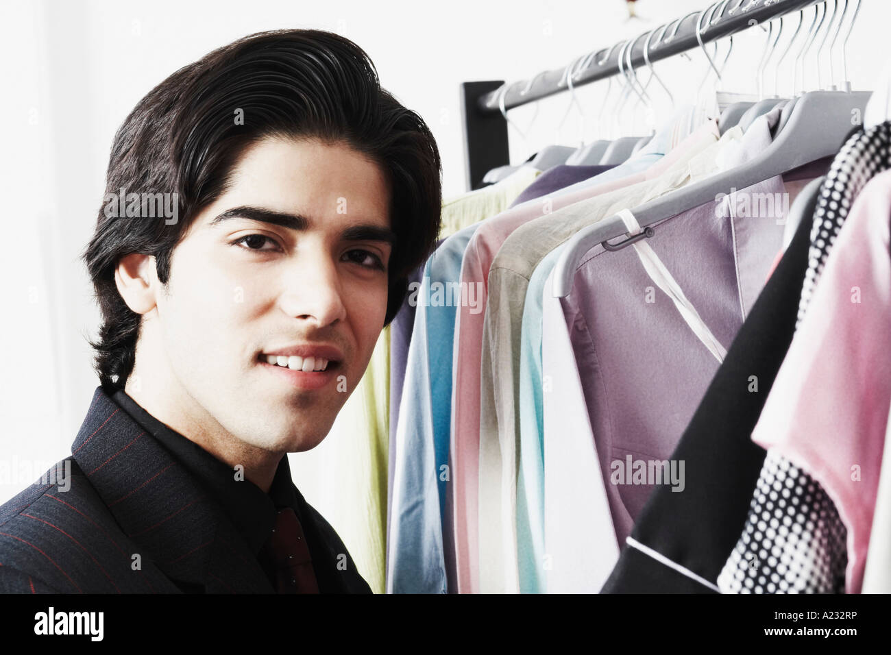 Portrait of a young man in a clothing store Stock Photo - Alamy