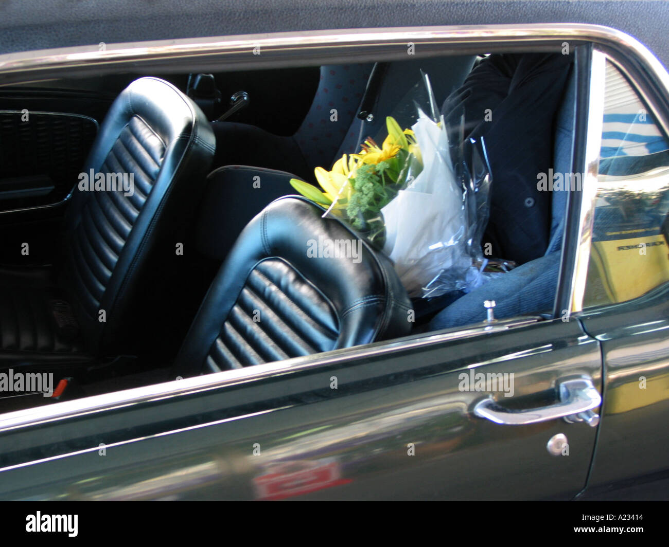Flowers in the back seat of a car Stock Photo