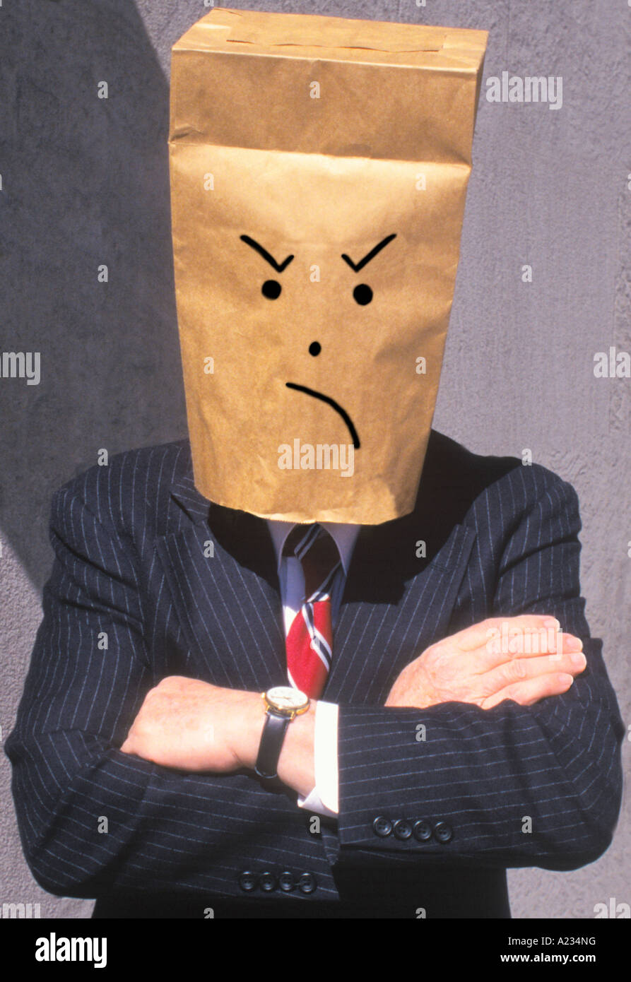 Anonymous businessman frown. Brown paper bag over head Stock Photo