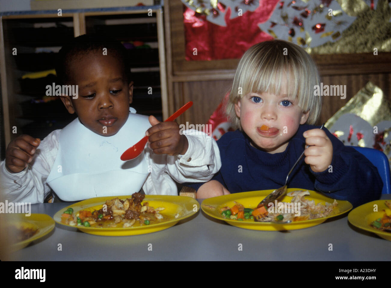 children eating with spoons and forks Stock Photo Alamy