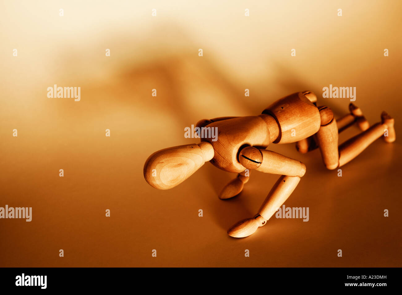 Wooden mannequin kneeling on all fours Stock Photo - Alamy