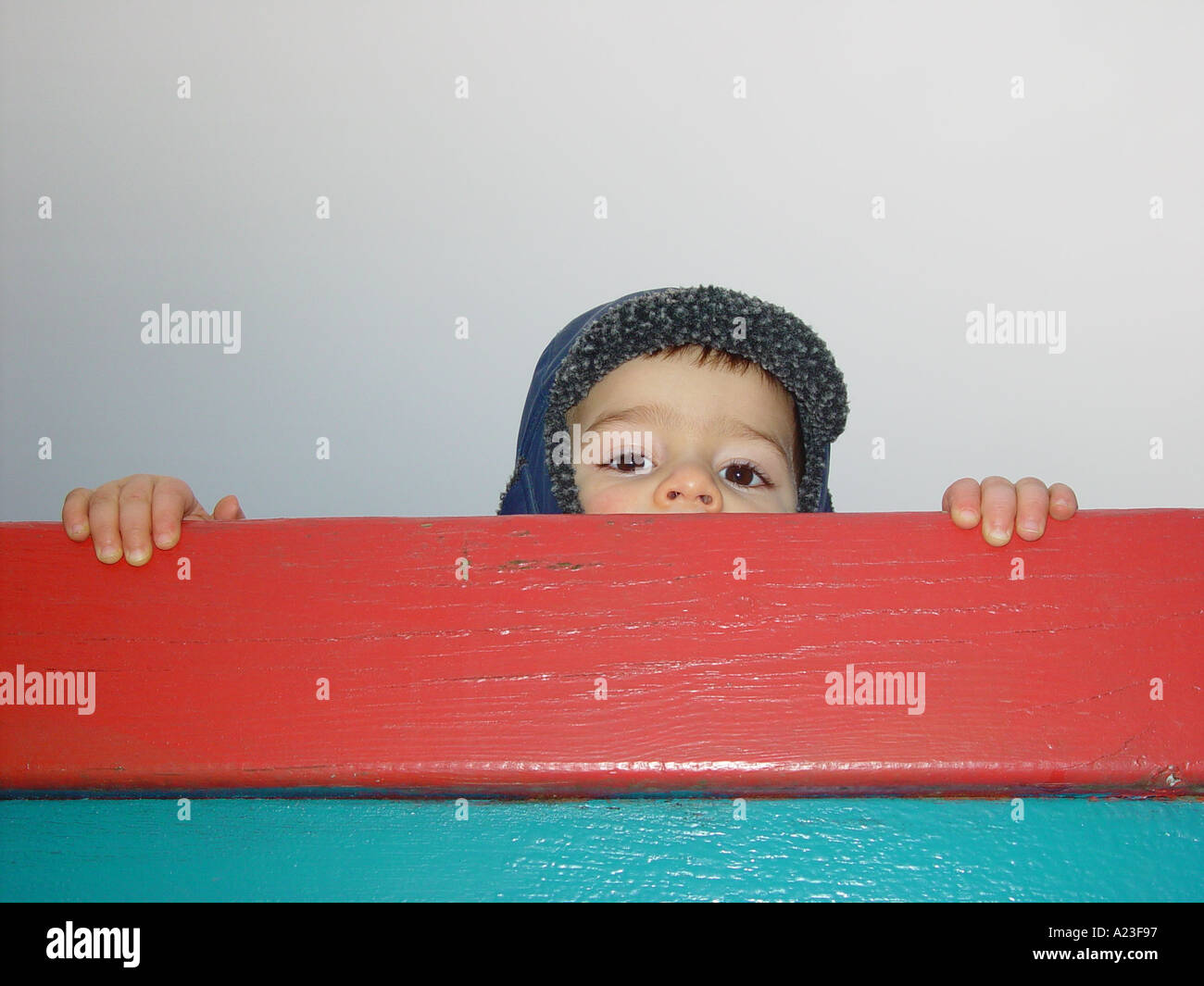 Boy looking after his mother or farther in a public nursery at the playground in afternoon Stock Photo