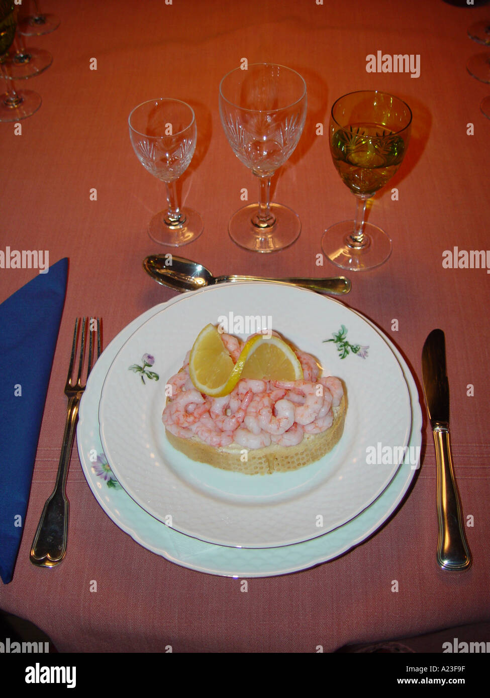 Open sandwich with shrimps on white bread on dining table Denmark Stock Photo