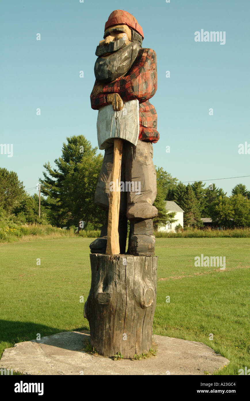 Wooden statue of Wooden statue of Lumberjack with ax in his hand Stock