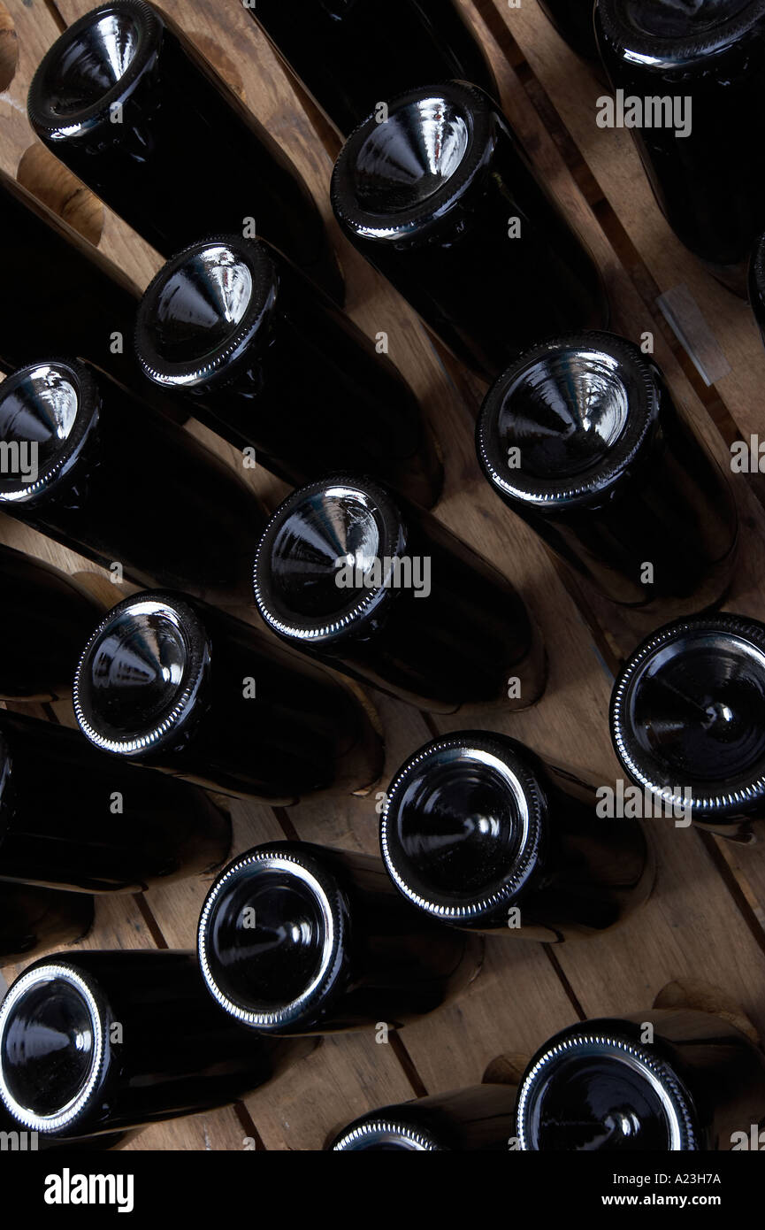 bottles of sparkling wine or champagne on riddling rack Stock Photo Alamy