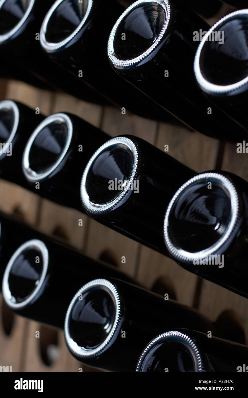 bottles of sparkling wine or champagne on riddling rack Stock Photo Alamy