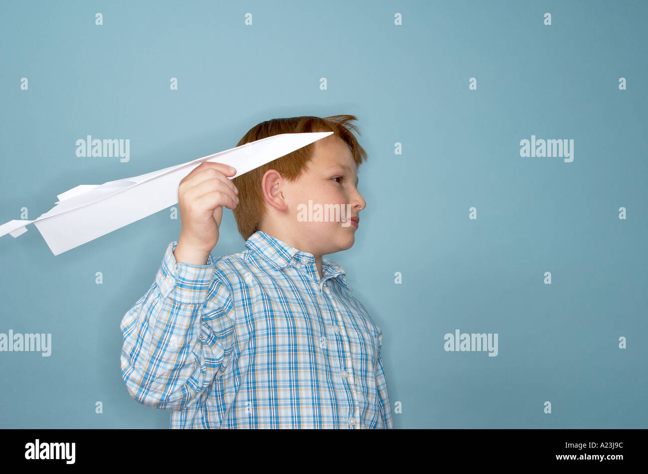 boy playing with paper plane Stock Photo