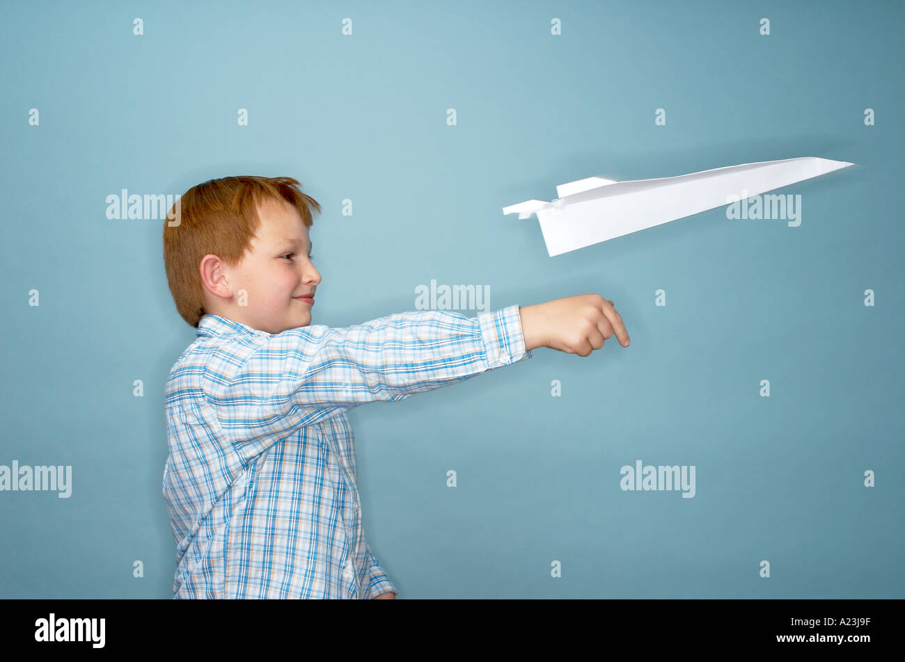 boy playing with paper plane Stock Photo