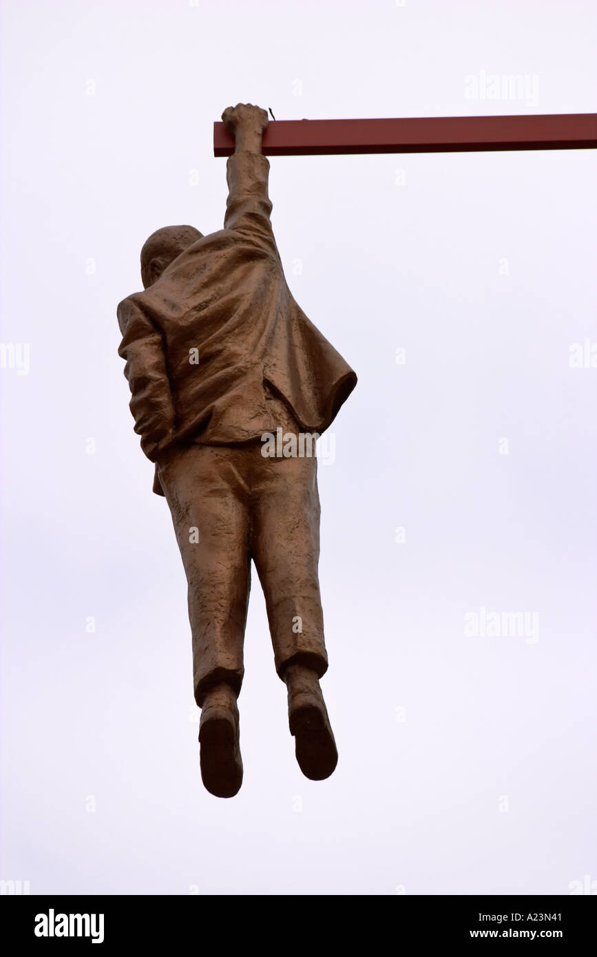 Statue of Sigmund Freud by David Černý hanging over Husova Street in