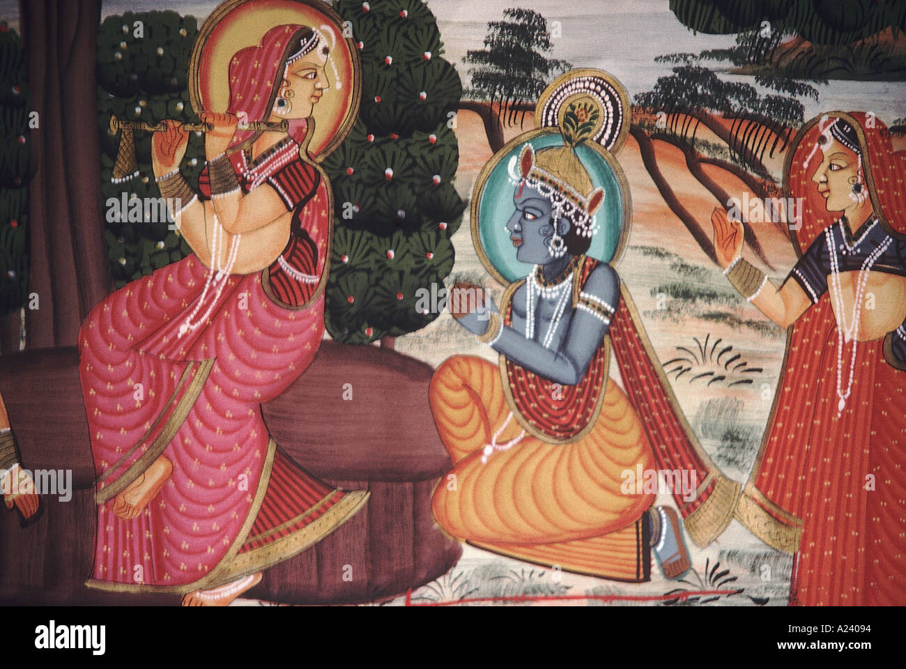Radha playing the flute while Krishna watches. Rajasthani painting. India. Stock Photo