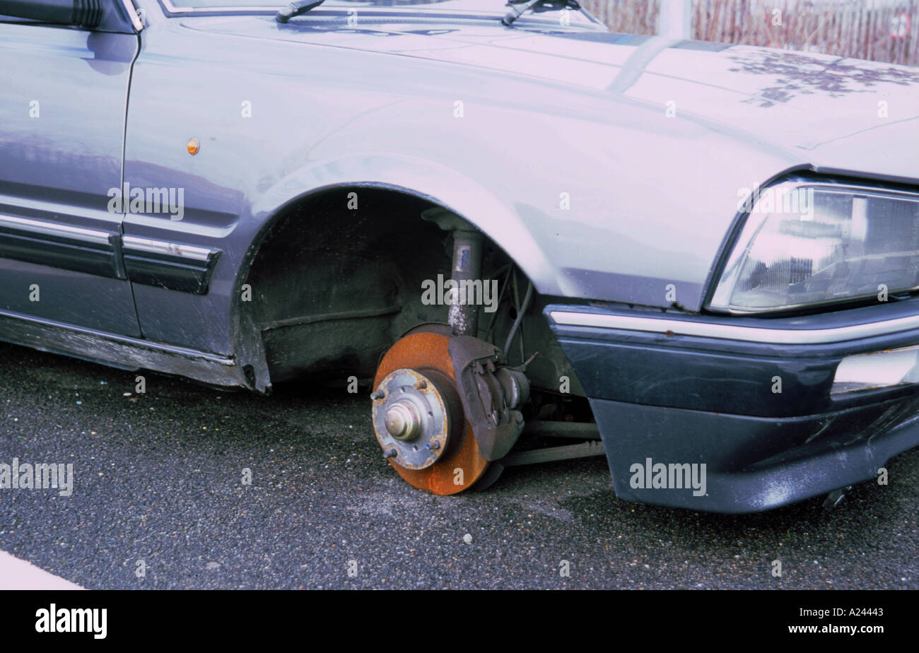 Car with wheels stolen Stock Photo Alamy