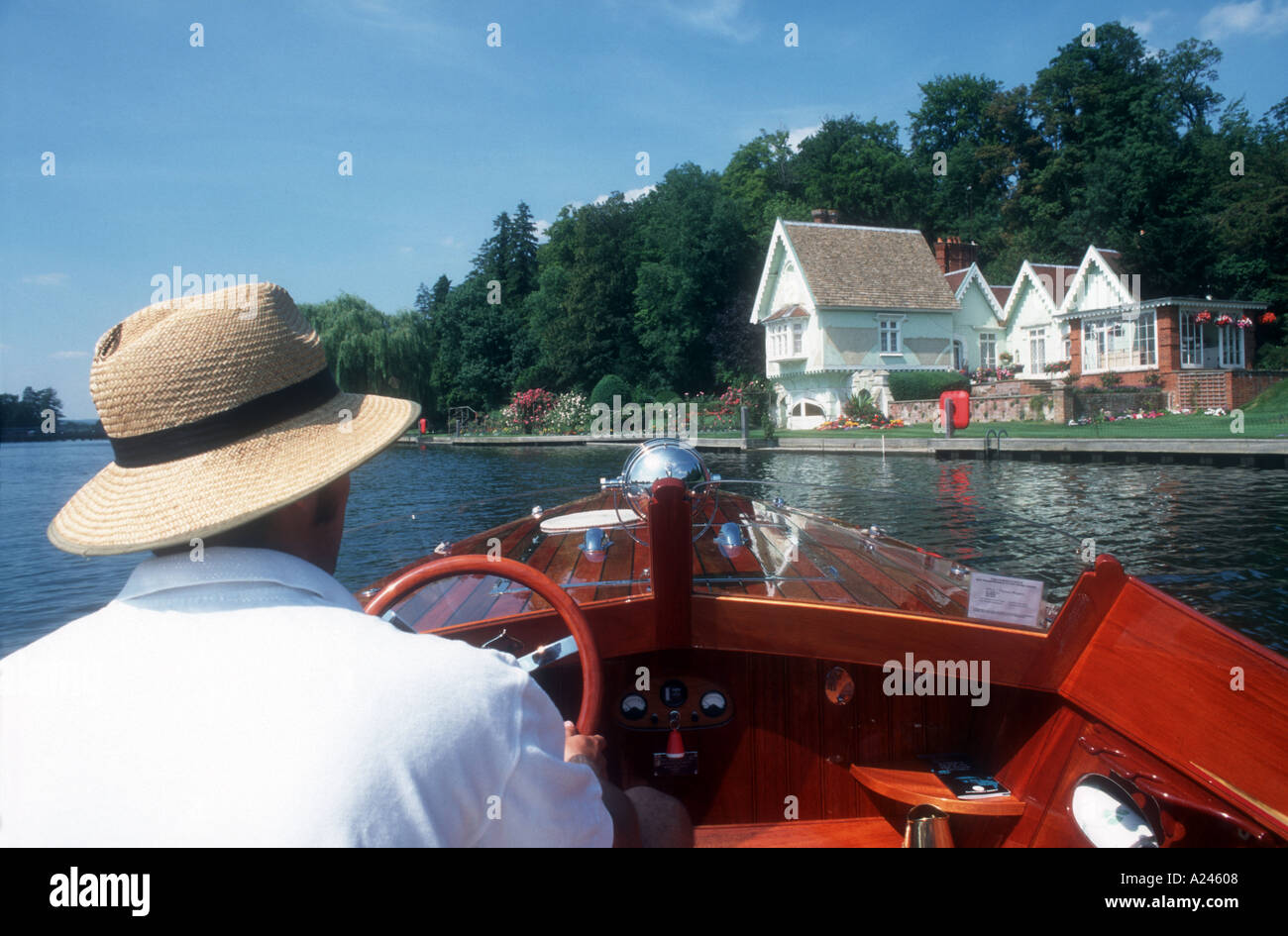 A young man in an electric powered slipper launch River Thames Henley on Thames Oxfordshire England UK  Stock Photo