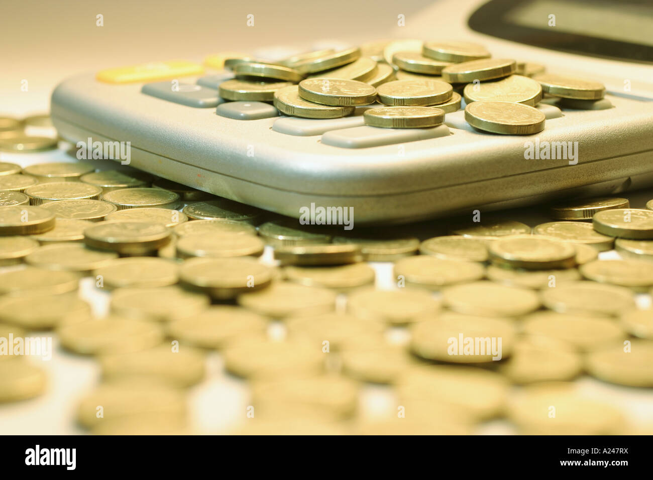 Calculator and Coins Stock Photo - Alamy