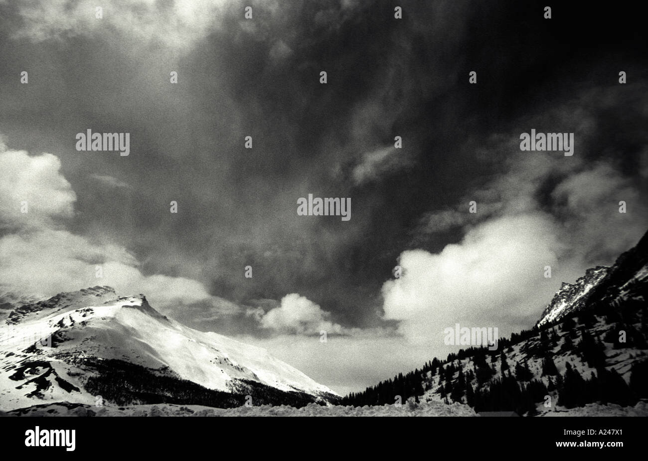 Wild skies in the Canadian Rockies, threatening snow blizzards Stock Photo