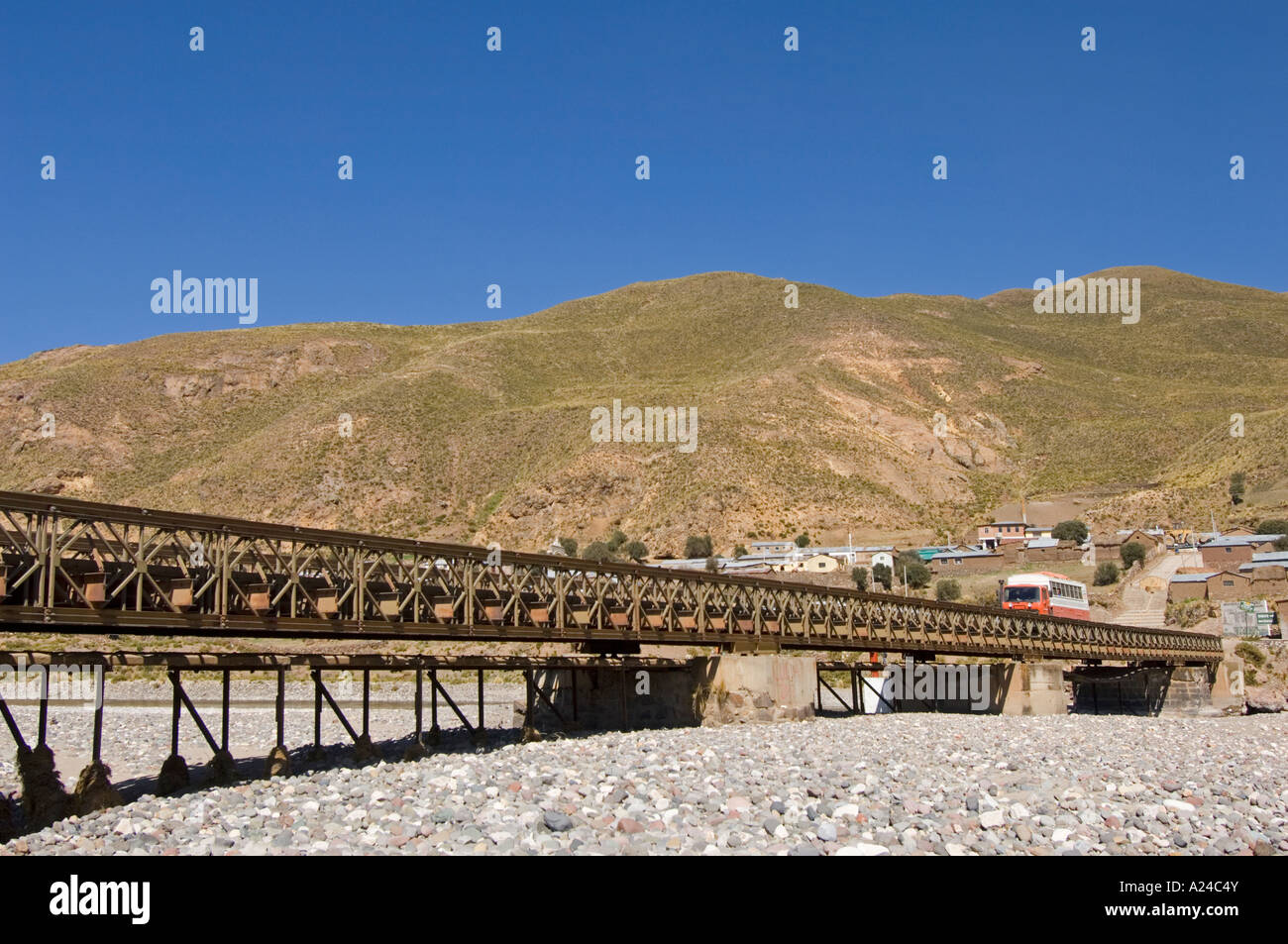 An overland adventure holiday truck crossing the bridge over the (dry) Desaguadero river in Peru. Stock Photo