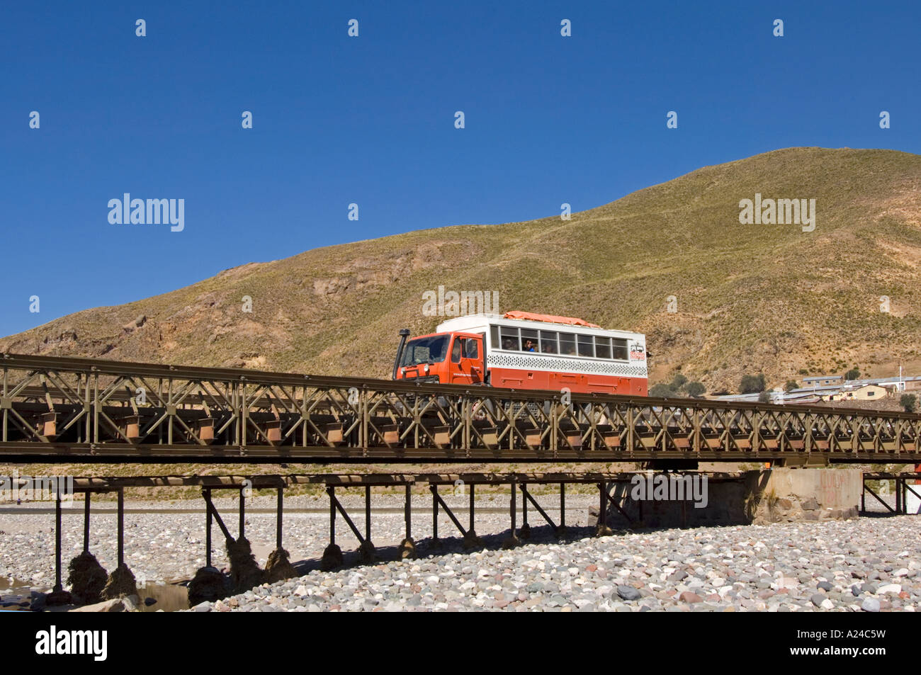 An overland adventure holiday truck crossing the bridge over the (dry) Desaguadero river in Peru. Stock Photo