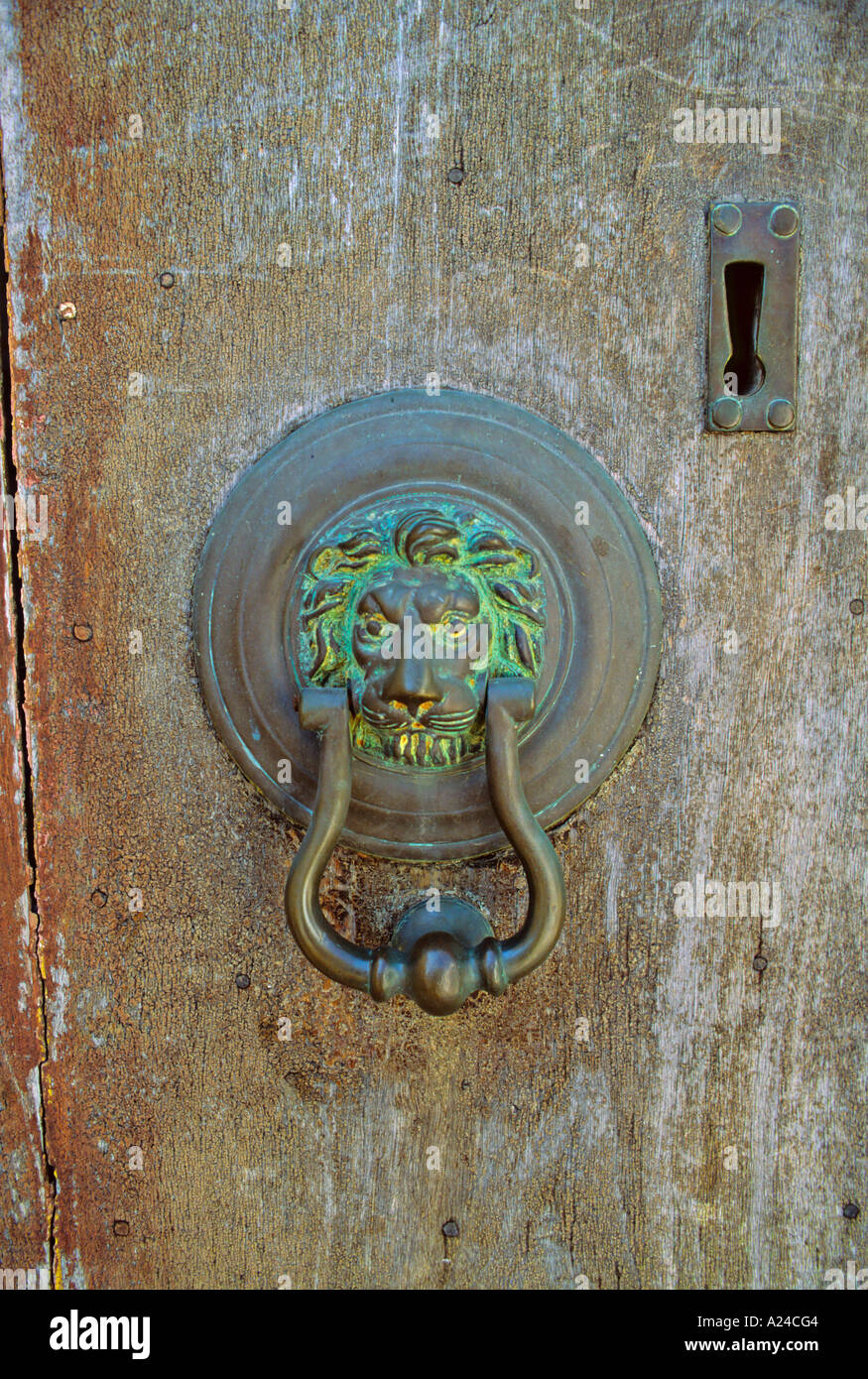 Lion head door knocker and upside down keyhole Greece Stock Photo Alamy