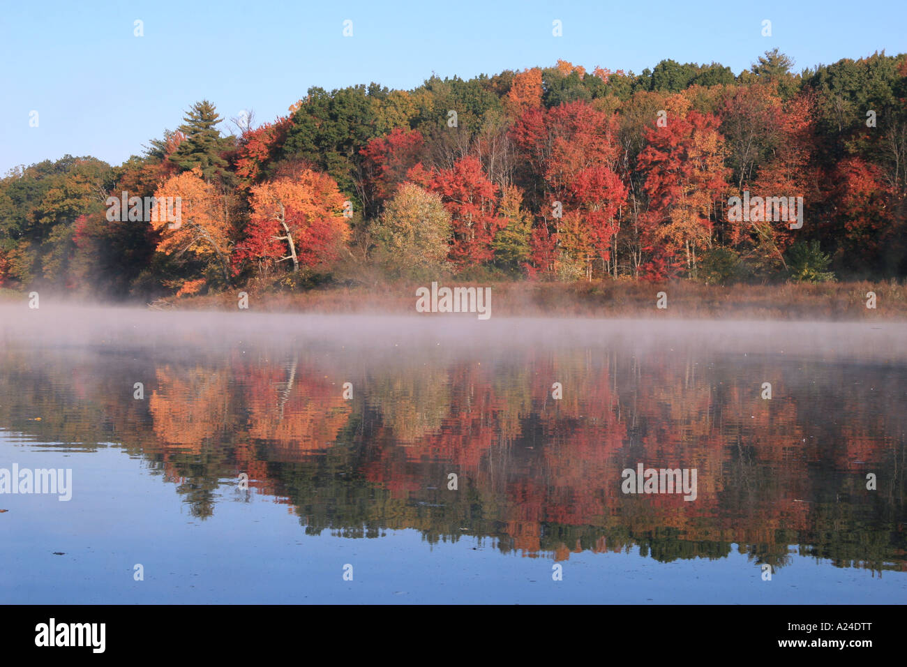 Mist rising on the Assabet river in October. Stock Photo
