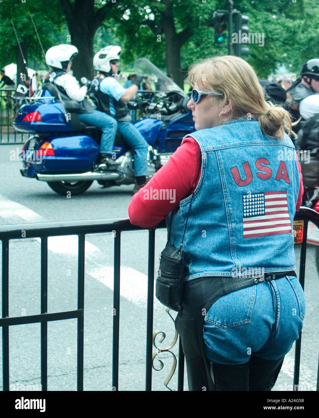 Woman watching motorcycles Stock Photo