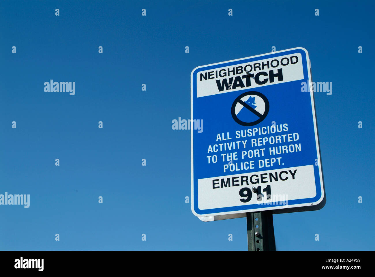 Neighborhood watch sign advises suspicious activity to be reported to 911 police Stock Photo