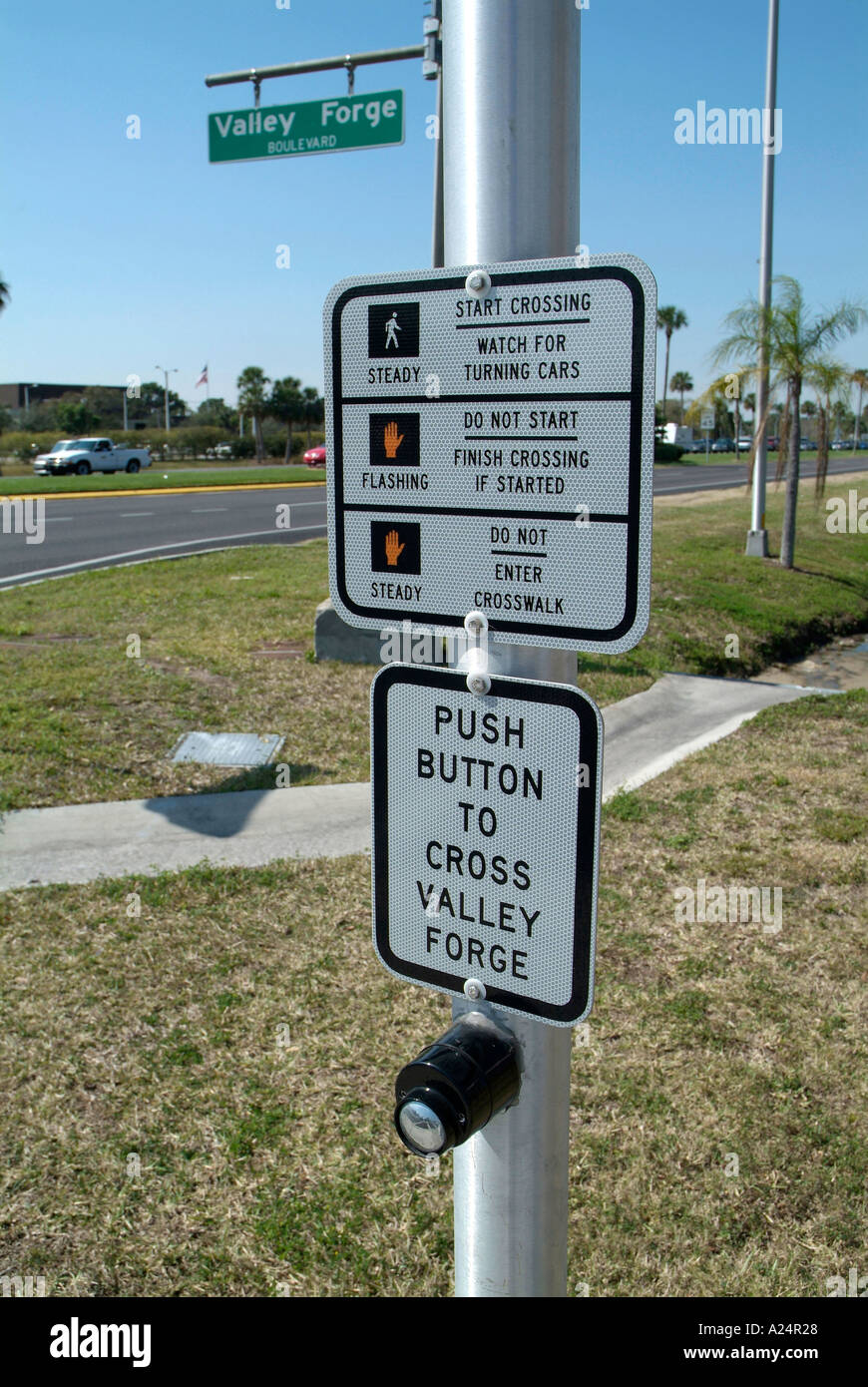Instructions and directions on how to cross the street at a busy
