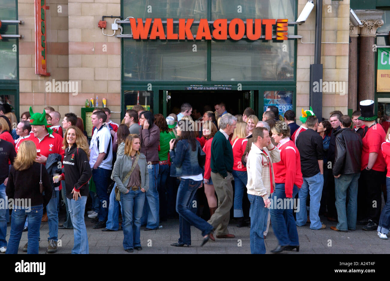 Rugby fans outside WALKABOUT INN queuing to get into pubs and bars in Cardiff on the day of a Wales international match Stock Photo