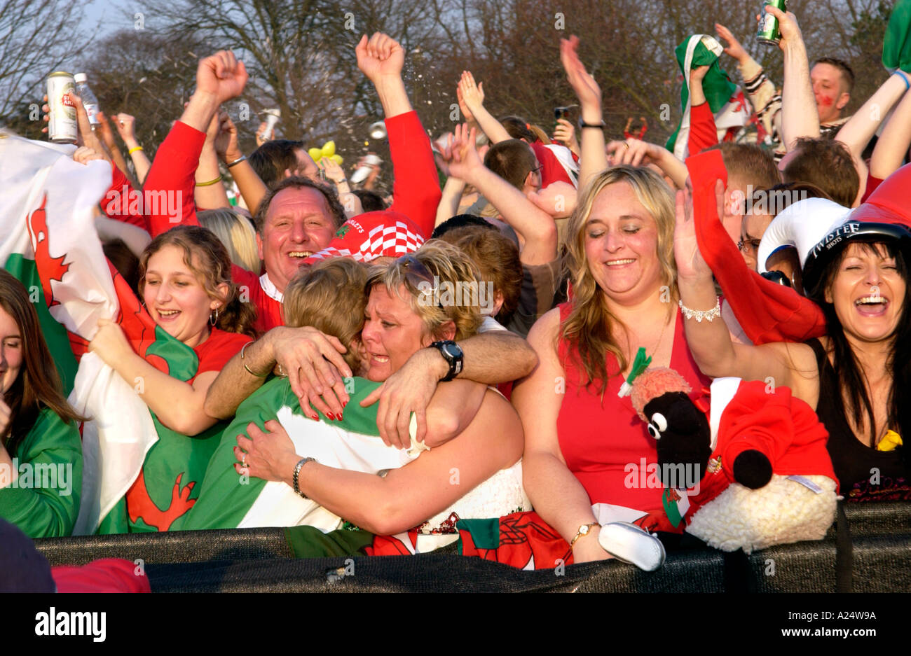 Female Welsh rugby fans celebrate Wales winning an international match in Cardiff South Wales UK Stock Photo