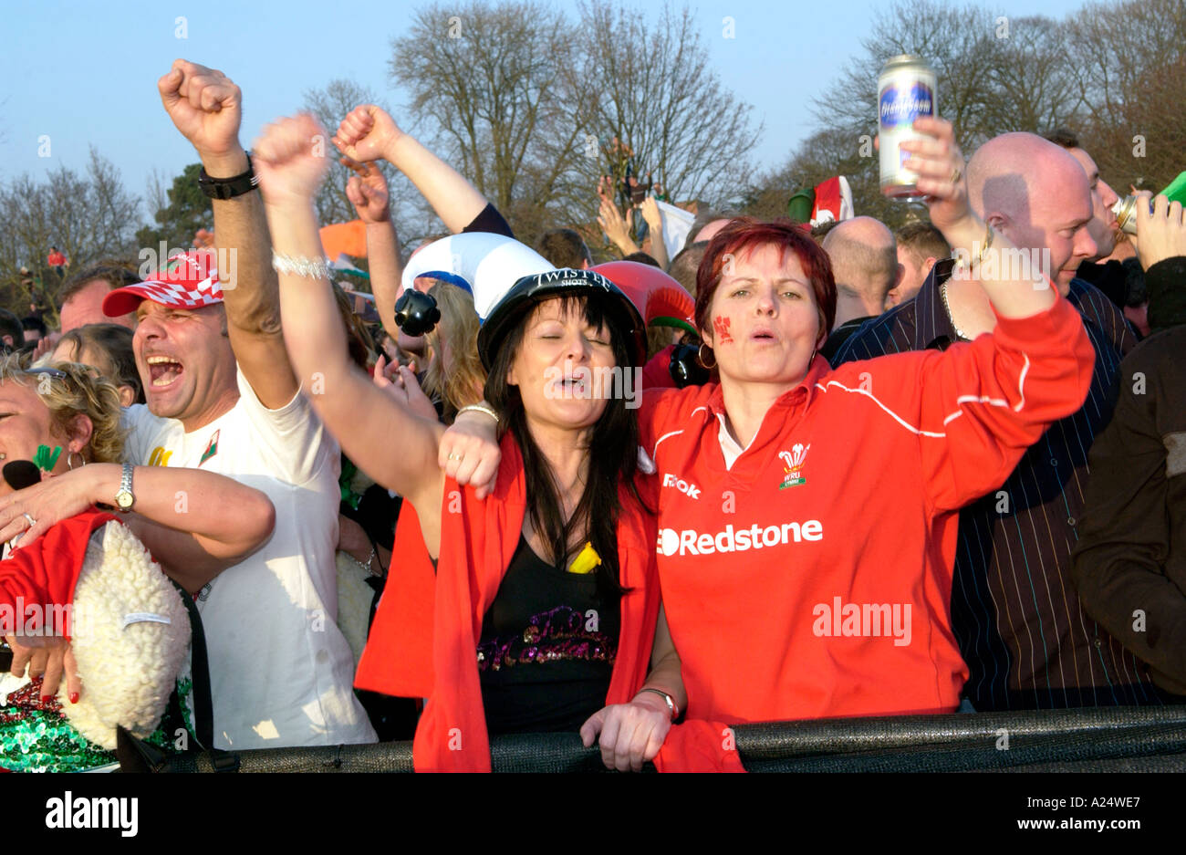 Female Welsh rugby fans celebrate Wales winning an international match in Cardiff South Wales UK Stock Photo