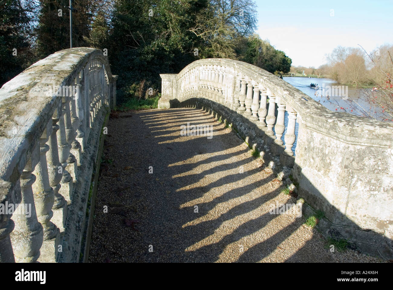 Light Shadows of Carved Balustrade Posts on Decorative White Foot Bridge Iffley Lock River Thames Oxford England 2007 Stock Photo