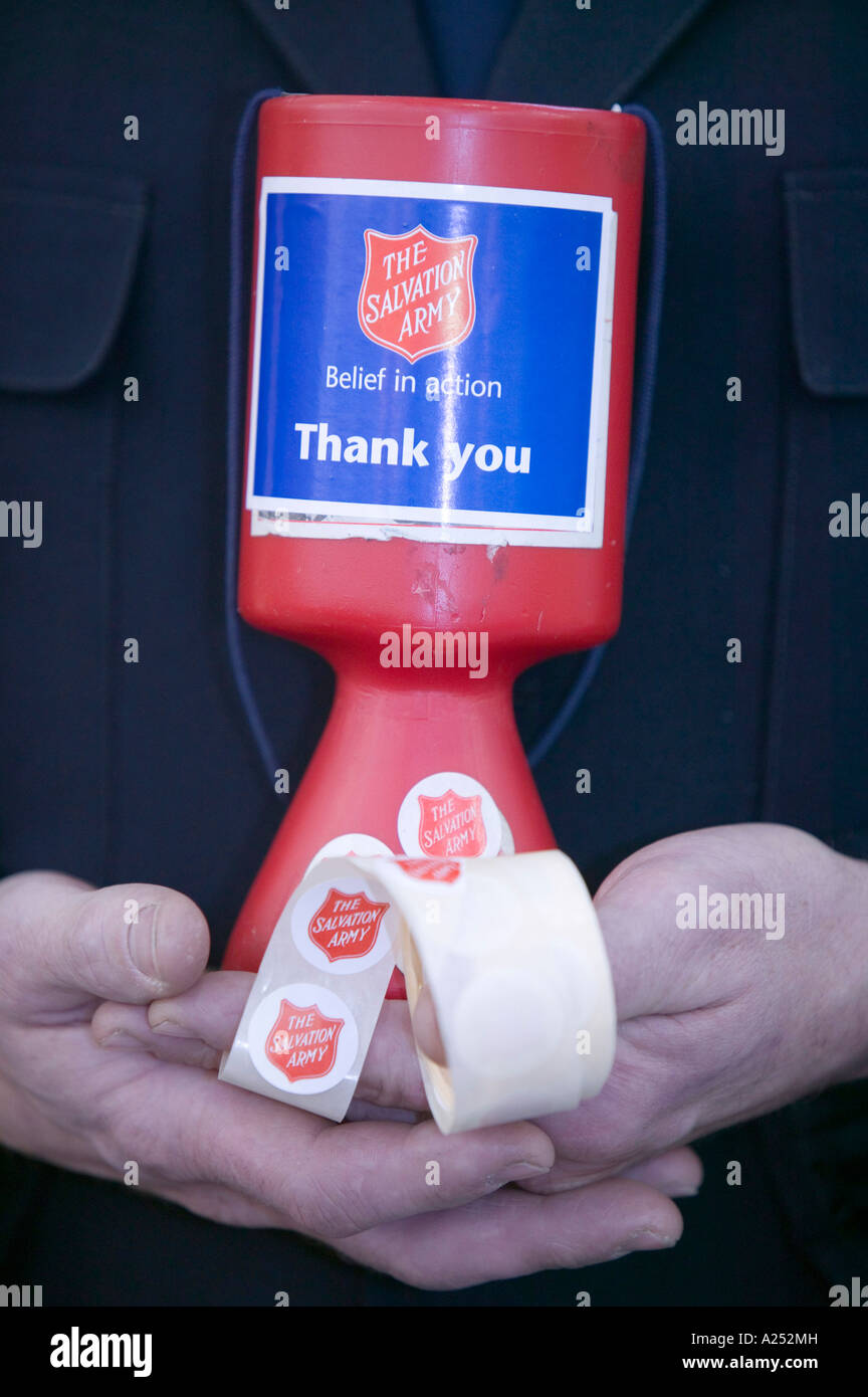 Salvation Army member collecting charitable donations, Kendal, Cumbria, UK Stock Photo