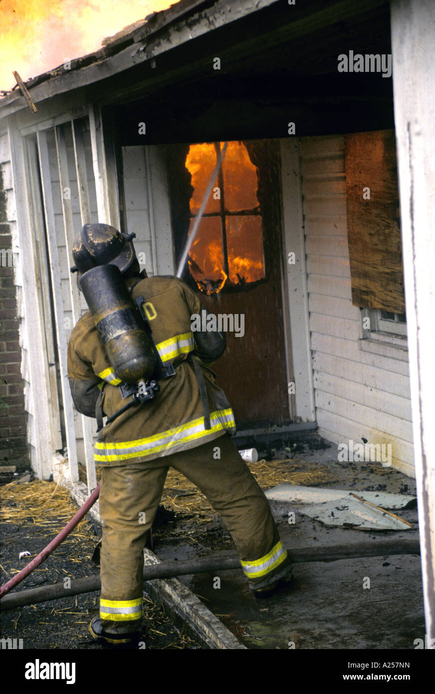 Firefighter fighting a house fire in Maryland Stock Photo Alamy