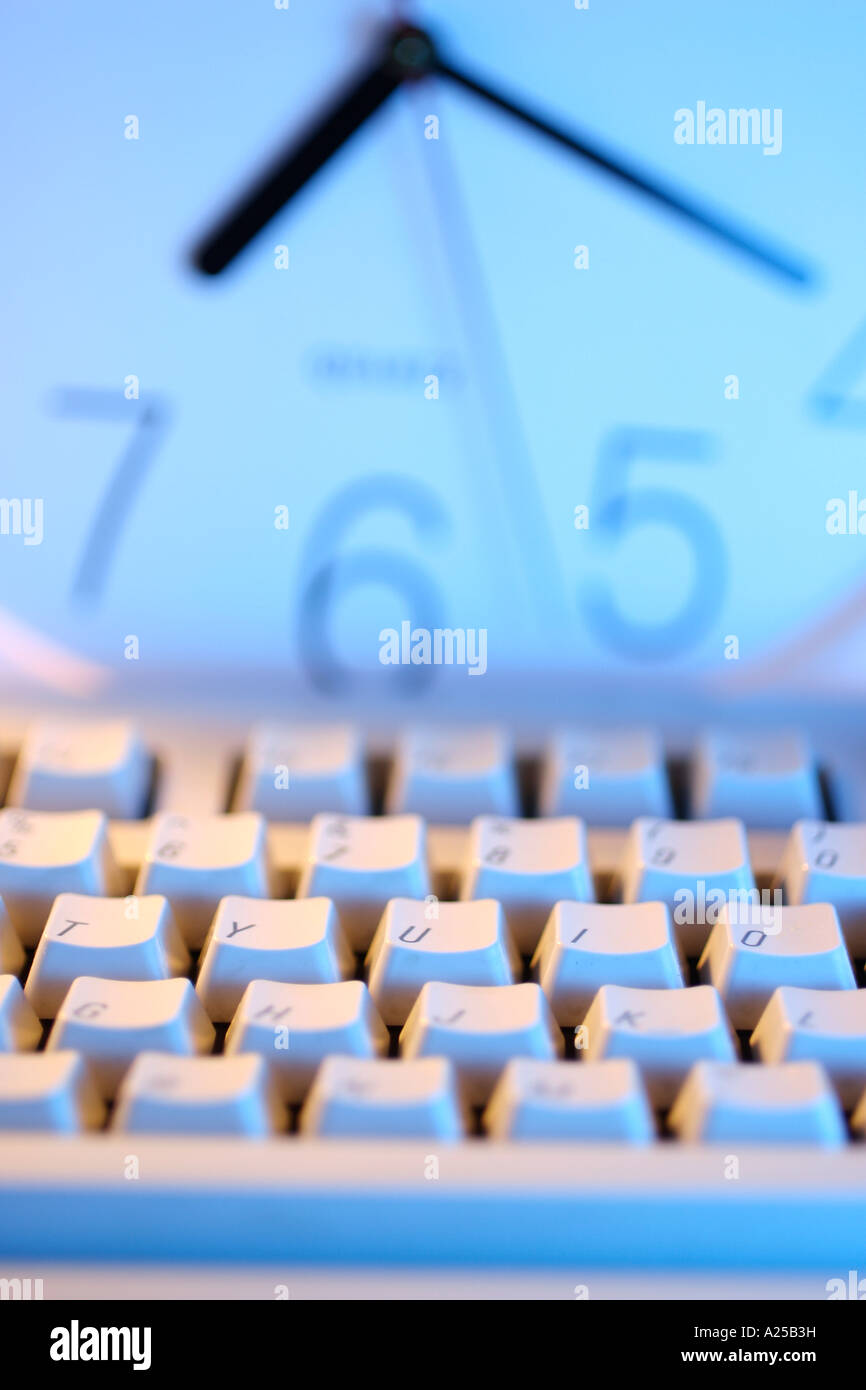 Computer Keyboard and Clock Stock Photo Alamy