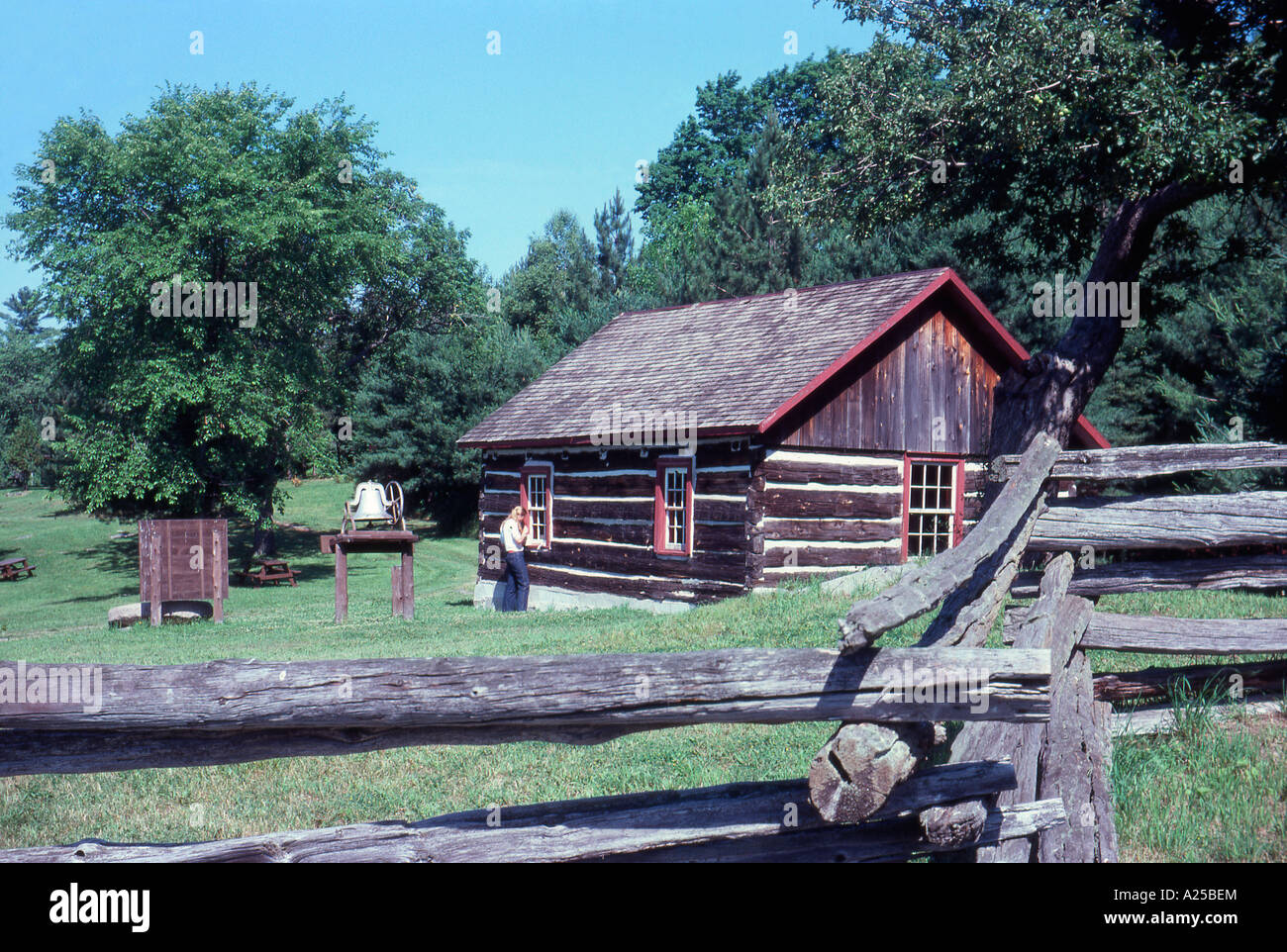 Split rail fence surrounding a beautiful old style farm. A time from