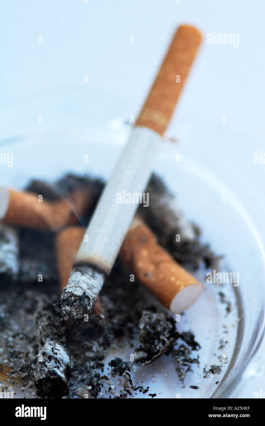 cigarette burning in ashtray 59 On Table Stock Photos, High-Res Pictures, and Images Cigarette Burning With Smoking On