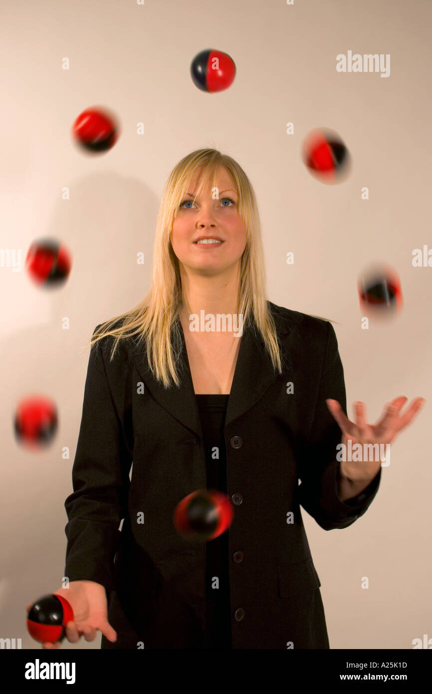 Caucasian young female juggling with eight balls Stock Photo Alamy