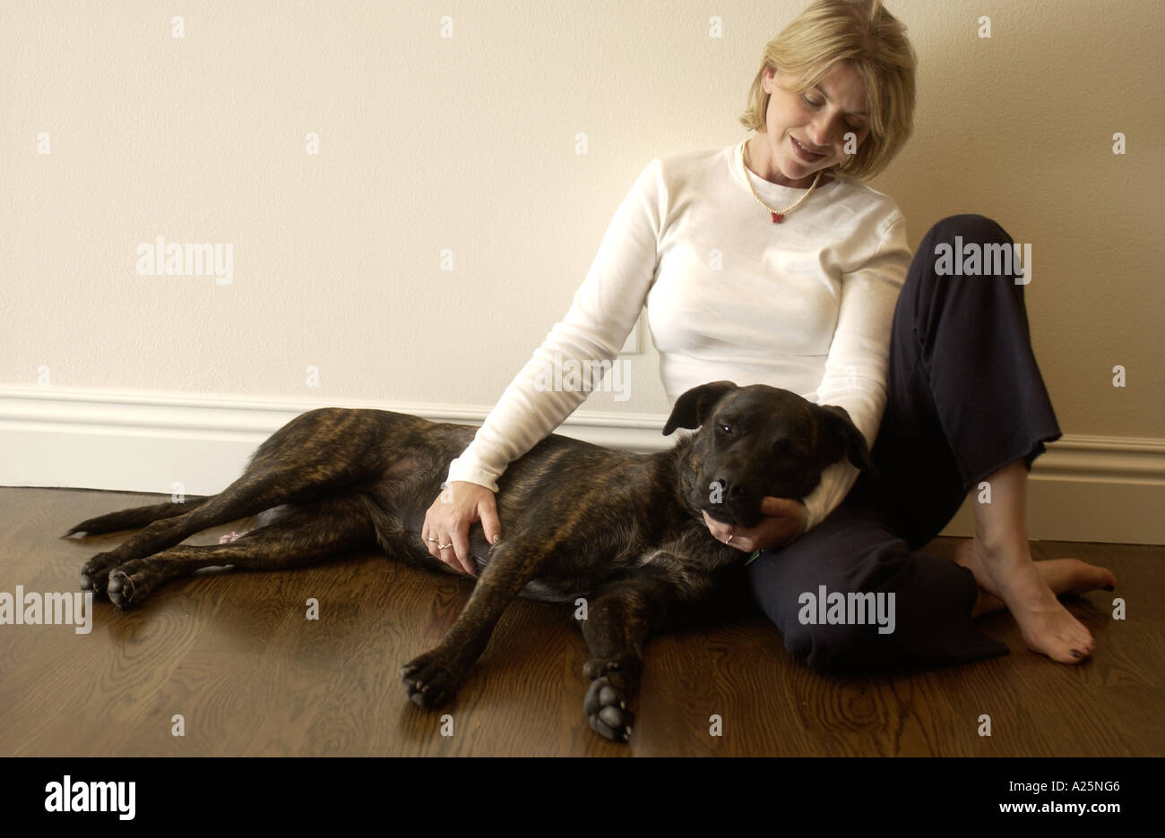 A portrait of a woman with her dog Stock Photo